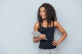 Cheerful afro american woman holding tablet computer Royalty Free Stock Photo
