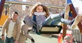 family with two girls having fun on swings outdoors