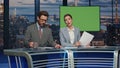 Cheerful anchors smiling mockup studio evening television closeup. Breaking news Royalty Free Stock Photo