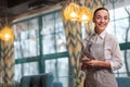 Cheerful appealing waitress performing work