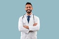 Cheerful Arab Doctor Man Posing With Stethoscope Over Blue Background Royalty Free Stock Photo