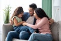 Cheerful Arabic Family Of Three Having Fun At Home, Laughing Together Royalty Free Stock Photo