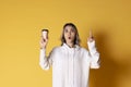 Women with coffee on yellow background Royalty Free Stock Photo