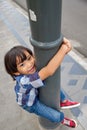 Cheerful Asian Child Having Fun on Sidewallk Royalty Free Stock Photo