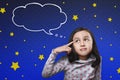 Cheerful asian child thinking with cloud space for text Royalty Free Stock Photo