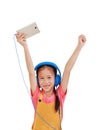 Cheerful Asian little girl child raise hands up enjoy with smartphone and headphones on white background. Image with