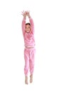 Cheerful asian little kid girl in pink tracksuit or sport cloth jumping on air isolated on white background. Freedom kid movement Royalty Free Stock Photo
