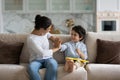 Cheerful asian mixed race family playing at home. Royalty Free Stock Photo