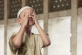 Cheerful asian muslim child praying to god Royalty Free Stock Photo
