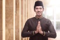 Cheerful asian muslim man praying to god Royalty Free Stock Photo