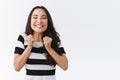 Cheerful asian woman cannot wait celebrate holiday halloween, dancing joyfully and excited, clench fists near chest