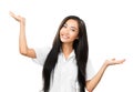Cheerful Asian woman gesturing with hands and looking at camera Royalty Free Stock Photo