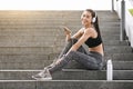 Asian Girl Listening Music On Smartphone, Resting After Fitness Workout In Park Royalty Free Stock Photo