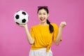 Cheerful Asian Young woman holding a soccer ball, football and people , FIFA World Cup concept Royalty Free Stock Photo