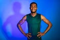 Cheerful Athlete Guy In Fitwear Posing Over Blue Studio Background Royalty Free Stock Photo