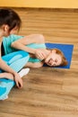 Cheerful athletes on blue mat