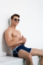 cheerful athletic man in sunglasses and