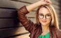 Smiling Attractive Blonde Girl With Natural Face Makeup Wearing Stylish Fashion Optical Eye Glasses. Minimalist urban clothing