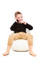 Cheerful attractive kid talking on a mobile phone
