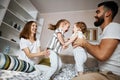 Cheerful attractive parents entertaining their kids Royalty Free Stock Photo