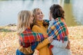 Cheerful attractive three young women best friends having fun together outside. Royalty Free Stock Photo