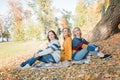 Cheerful attractive three young women best friends having picnic and fun together outside. Royalty Free Stock Photo