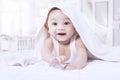 Cheerful baby boy under towel Royalty Free Stock Photo