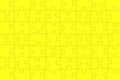 Cheerful background from yellow puzzles. Seamless bright wallpaper