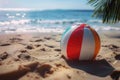 Cheerful beach ball rests on sun kissed sand, epitome of summer