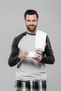 Bearded man holding cup of coffee isolated on grey Royalty Free Stock Photo