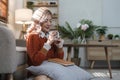 cheerful beautiful pretty asian woman smiling happy relaxing drinking of hot coffee or tea.Girl felling enjoy having in Royalty Free Stock Photo