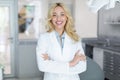 Cheerful beautiful woman doctor posing at newest dental clinic