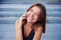 Cheerful beautiful woman laughing with eyes closed while talking Royalty Free Stock Photo