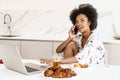 Cheerful beautiful woman using laptop for a video call Royalty Free Stock Photo
