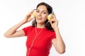 Cheerful beautiful young lady listening music by using headphone with smiley face, happiness when pretty girl listen nice music ma Royalty Free Stock Photo