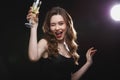 Cheerful beautiful young woman drinking champagne Royalty Free Stock Photo