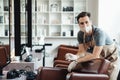 Cheerful beauty master in protective mask waiting for clients at empty salon