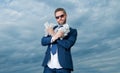 cheerful billionaire man with money in suit. photo of billionaire man with money.