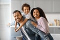 Cheerful Black Family With Little Son Hugging And Smiling At Camera Royalty Free Stock Photo