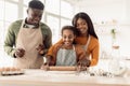 Black Family Rolling Out Dough Making Cookies Baking In Kitchen Royalty Free Stock Photo