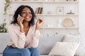 Cheerful Black Girl Talking On Mobile Phone With Her Boyfriend At Home Royalty Free Stock Photo