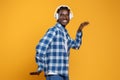 Cheerful Black Guy In Wireless Headphones Listening Music And Dancing Royalty Free Stock Photo