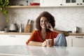 Cheerful Black Lady Drinking Coffee And Talking On Cellphone In Kitchen Royalty Free Stock Photo