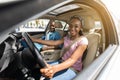 Cheerful black lovers sitting in car together Royalty Free Stock Photo