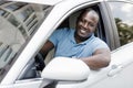 Handsome african american man driving car, shot from outside Royalty Free Stock Photo