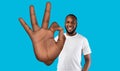 Cheerful black man showing big okay gesture, expressing his agreement or approval over blue background, panorama Royalty Free Stock Photo