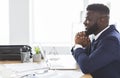 Cheerful black manager planning future at office