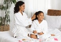 Cheerful Black Mother And Daughter In Bathrobes Having Beauty Day At Home Royalty Free Stock Photo