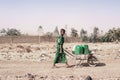 Cheerful Black Woman Engaged with Tap Water for an aridity concept