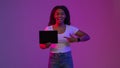 Cheerful Black Woman Pointing At Digital Tablet With Blank Screen In Hand Royalty Free Stock Photo